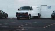 A white Ford Econoline van was standing idle in the parking lot (Representative Image via Unsplash/@Zachary Keimig)